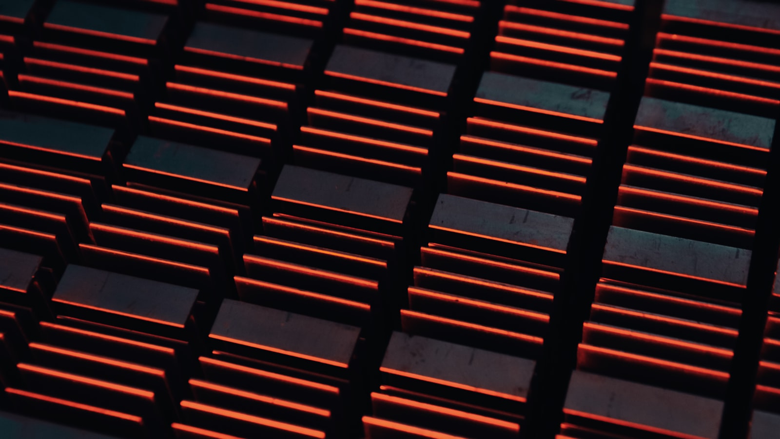 Close-up of an industrial Bitcoin mining rig - red status lights on a metal grate, the kind of hardware that produces hashrate at scale.