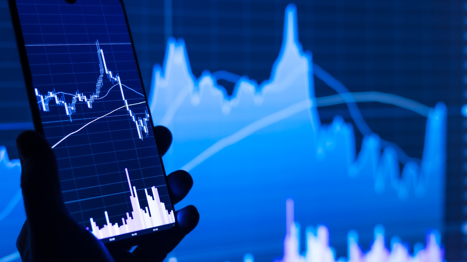 Investor reviewing a portfolio chart on a phone - allocating a 100,000 euro portfolio across ETFs, bonds, real estate and P2P lending.