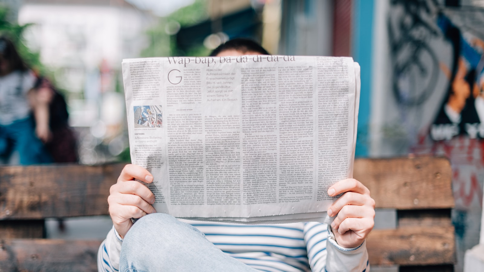 A pile of newspapers with warning headlines - red flags that identify a risky platform.