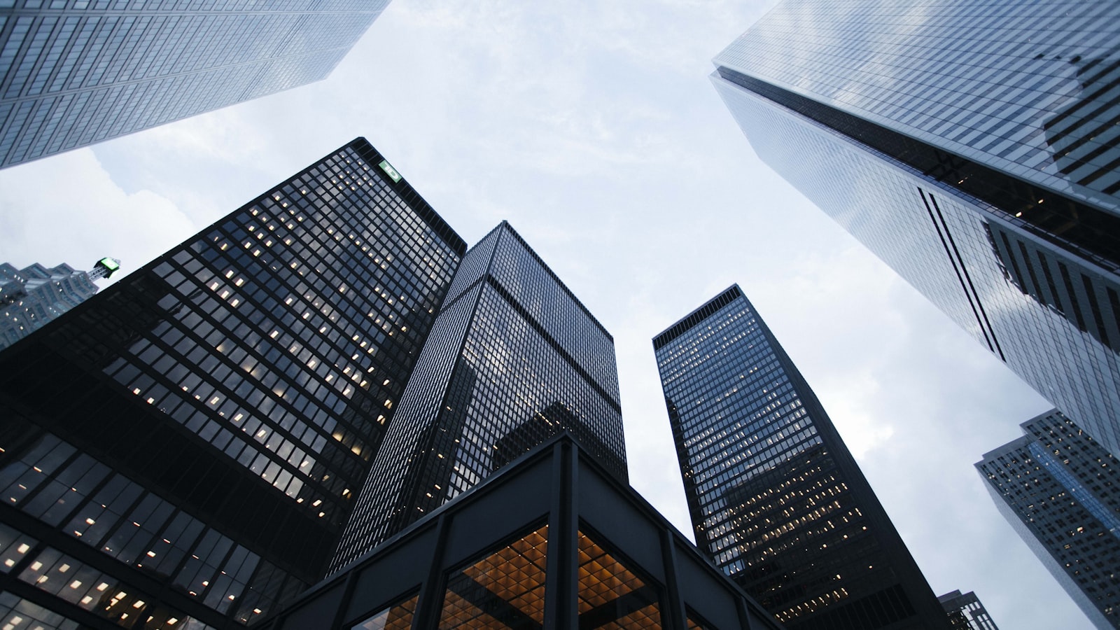 Modern apartment buildings - the choice between Mintos consumer loans and EstateGuru real estate.